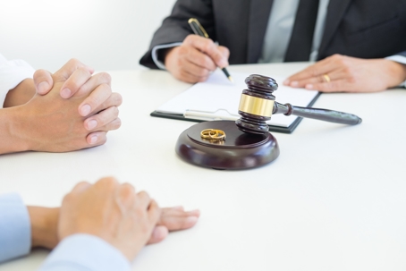 divorcing couple meeting with a lawyer