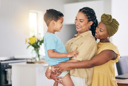 same sex couple with their adopted son
